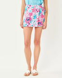 Woman wearing a floral skirt on a white background